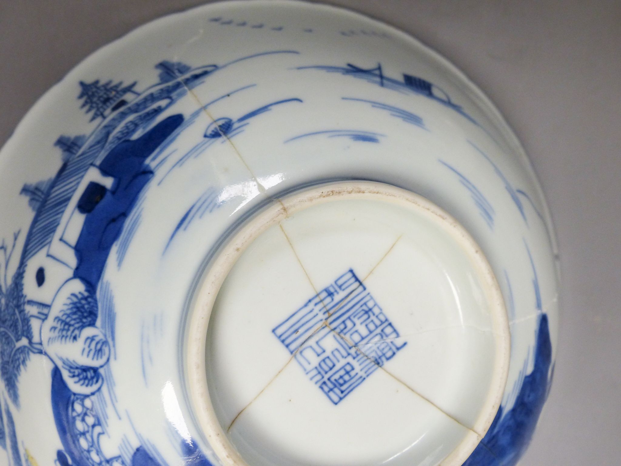 A Chinese blue and white landscape bowl, a/f and a Chinese blue and white ‘dragon’ dish, 18 and 16.5 cm